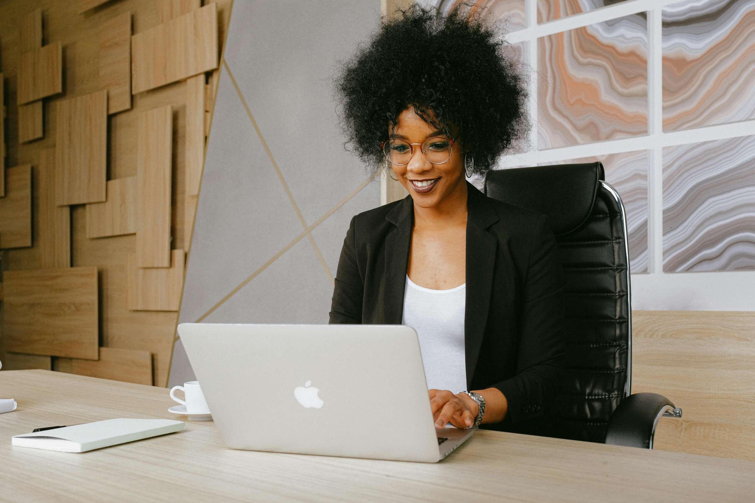 A woman working on a laptop